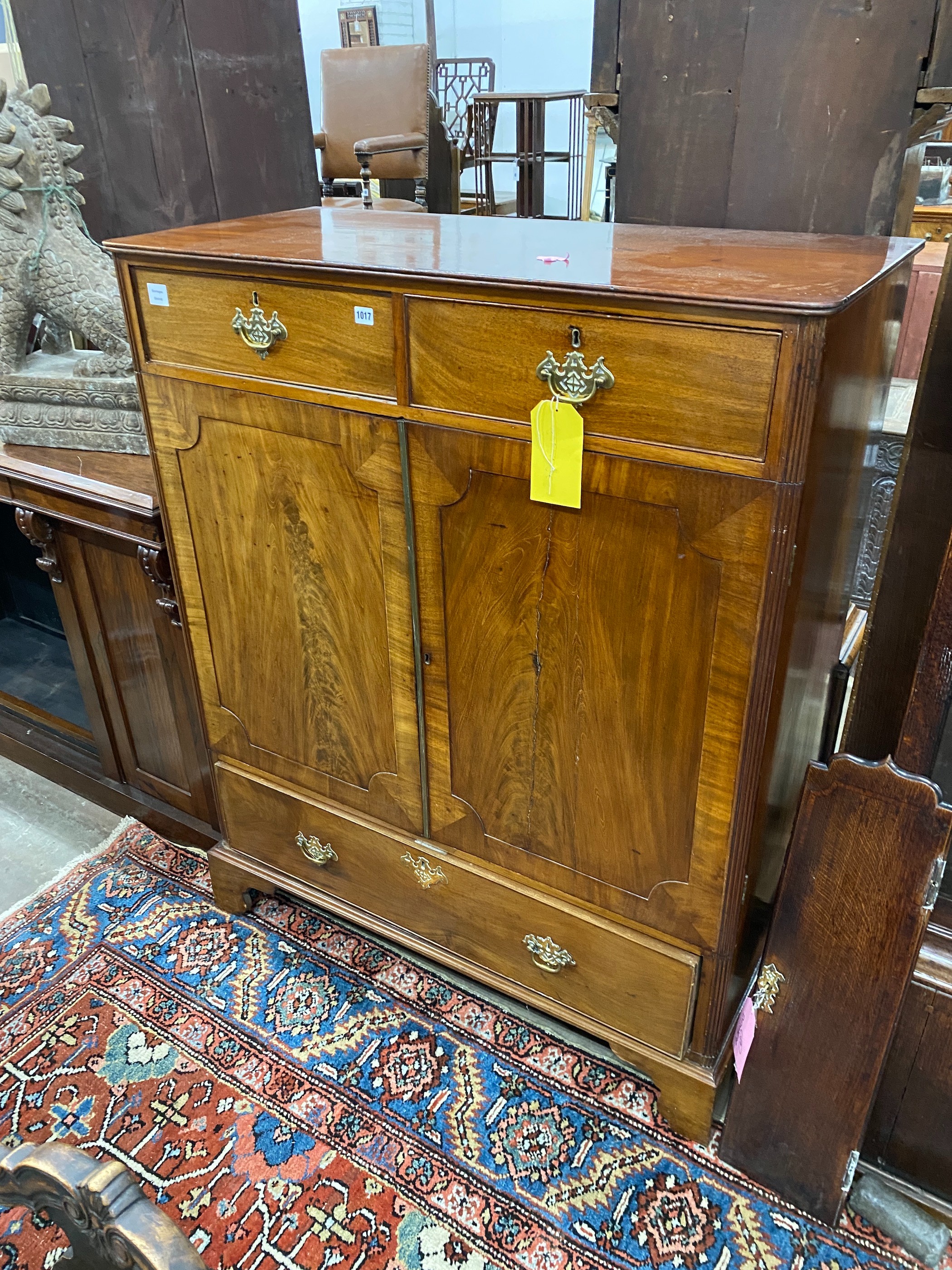 A George III mahogany press cupboard, width 115cm, depth 55cm, height 142cm